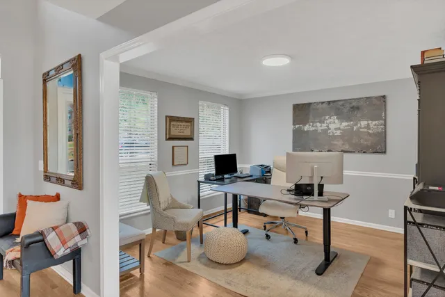 a workspace with furniture and a window