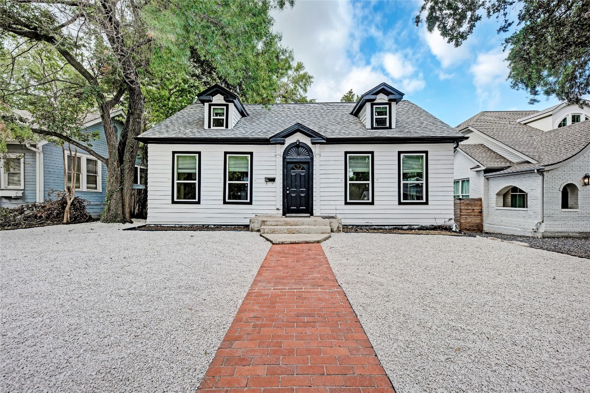 a front view of a house with yard