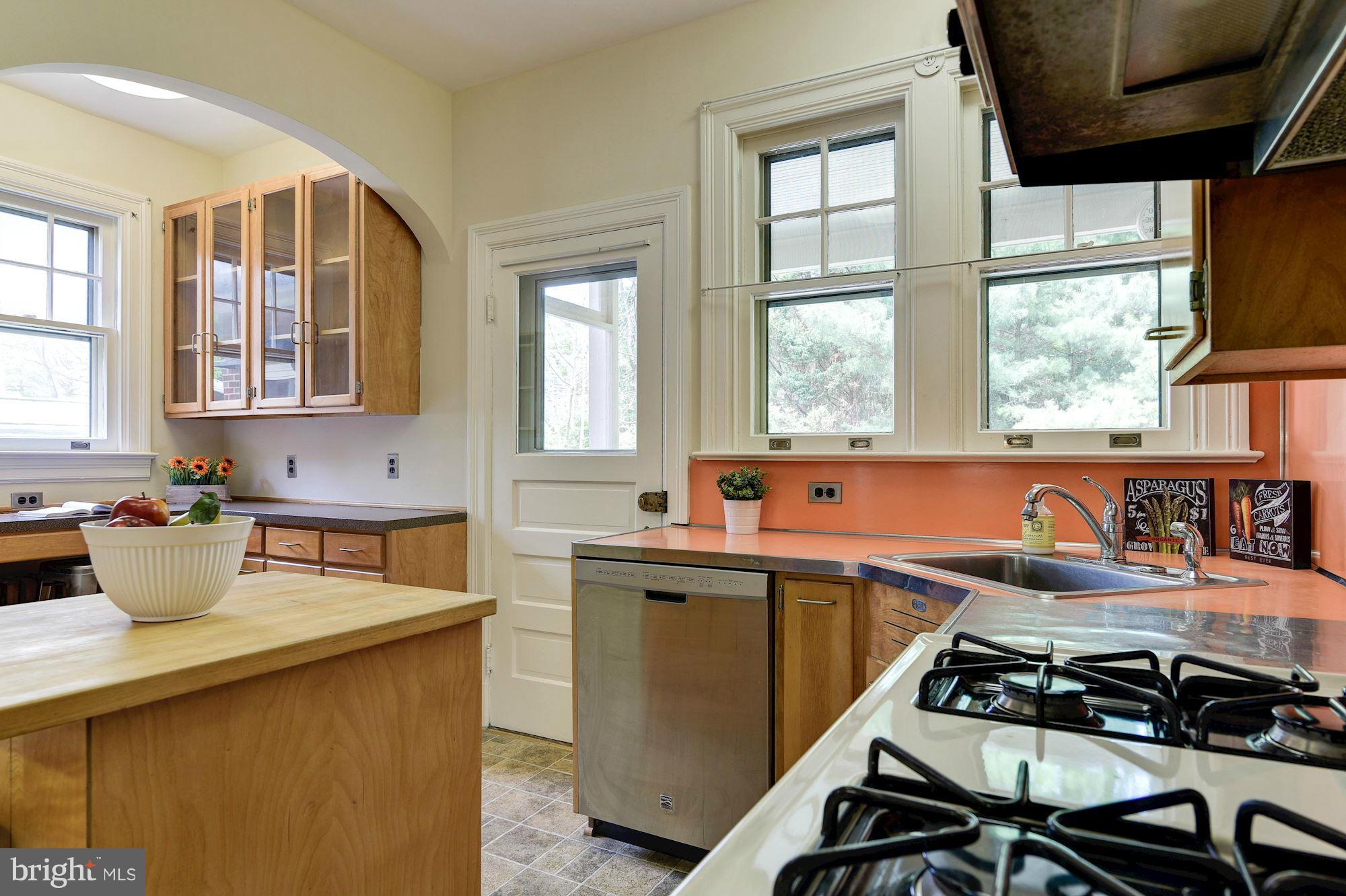 210 Baltimore Road Rockville, MD 20850 - Photo 11 of 30 a kitchen with a sink a stove and cabinets