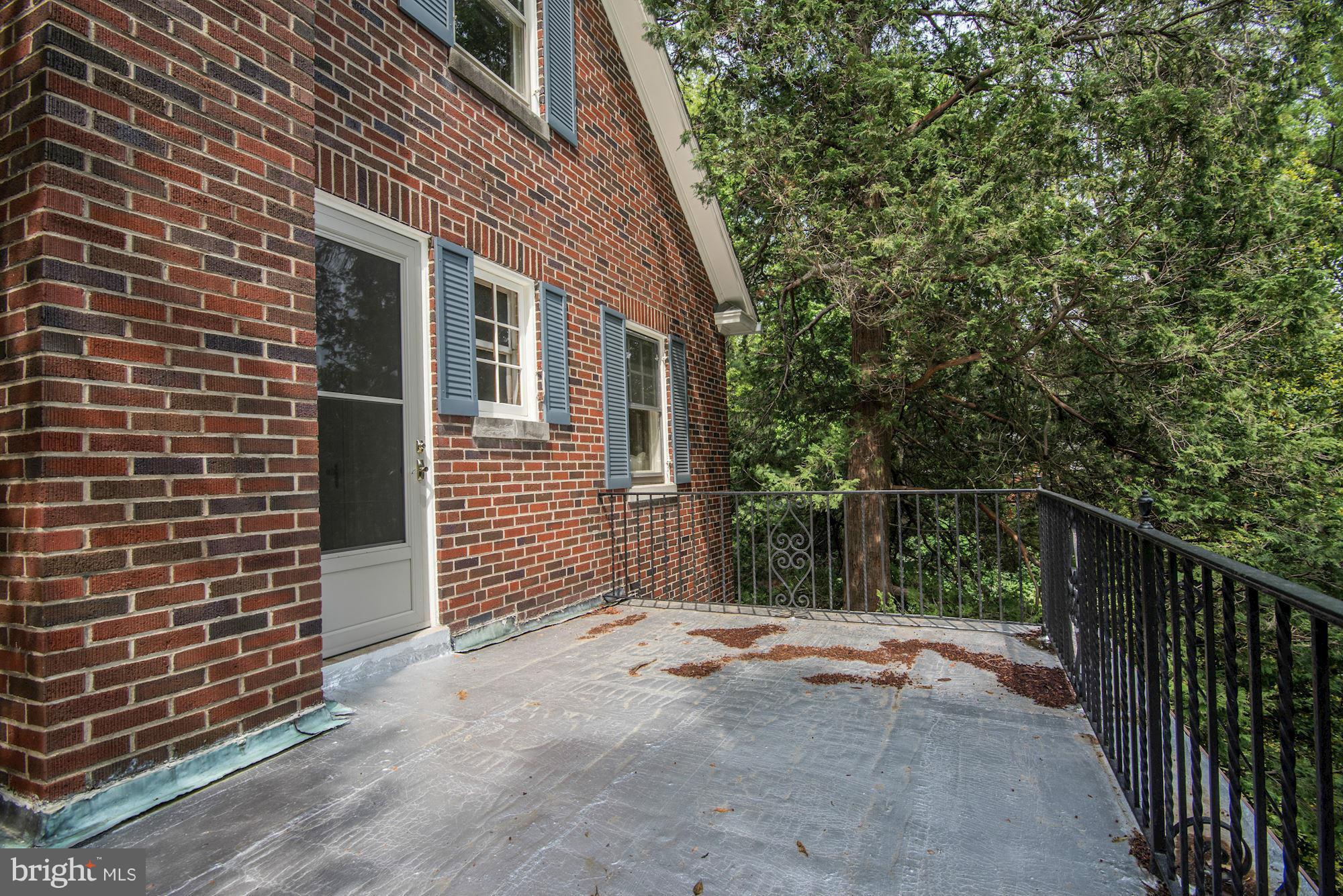 210 Baltimore Road Rockville, MD 20850 - Photo 16 of 30 a view of a house with a small yard and wooden fence