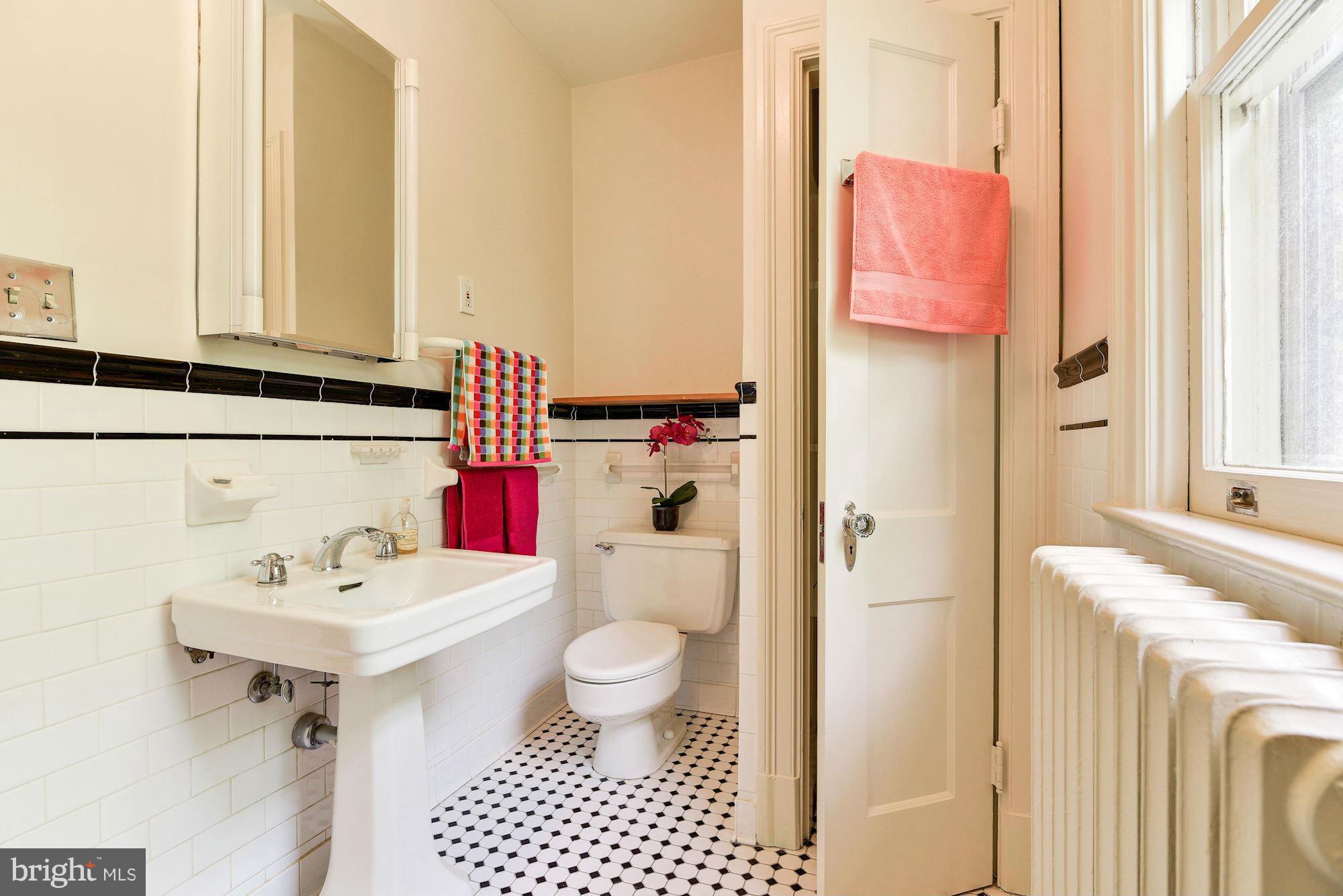 210 Baltimore Road Rockville, MD 20850 - Photo 18 of 30 a bathroom with a sink toilet and shower