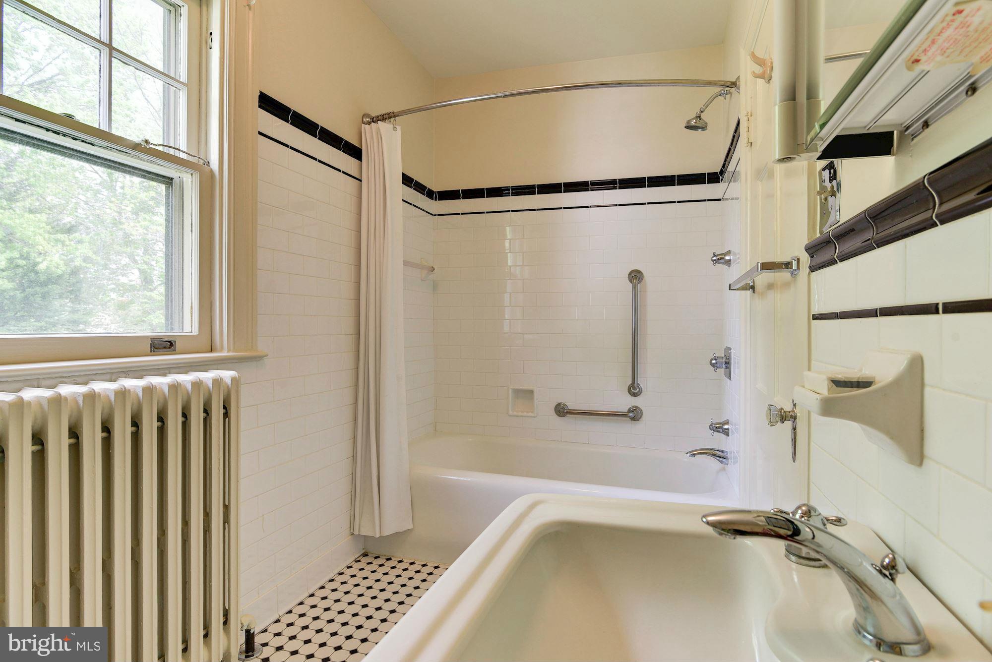 210 Baltimore Road Rockville, MD 20850 - Photo 19 of 30 a bathroom with a tub and a shower