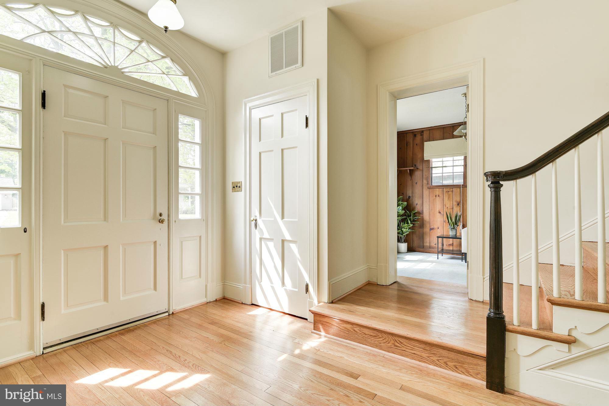 210 Baltimore Road Rockville, MD 20850 - Photo 2 of 30 a view of a hallway with wooden floor and staircase