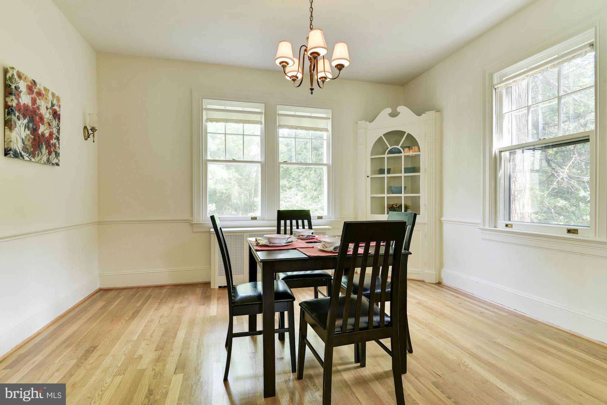 210 Baltimore Road Rockville, MD 20850 - Photo 6 of 30 a view of a dining room with furniture a chandelier and wooden floor