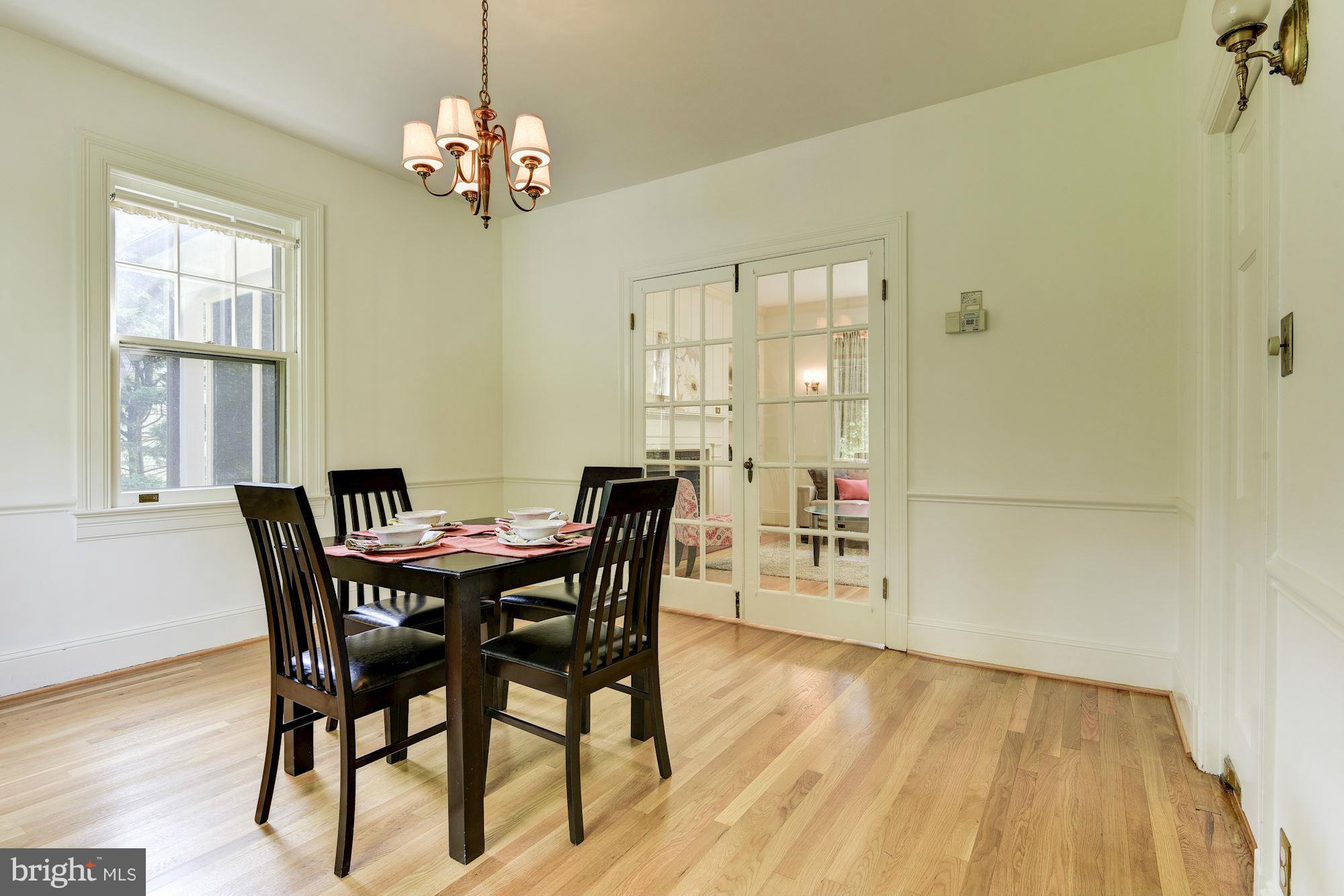 210 Baltimore Road Rockville, MD 20850 - Photo 7 of 30 a view of a dining room with furniture and wooden floor