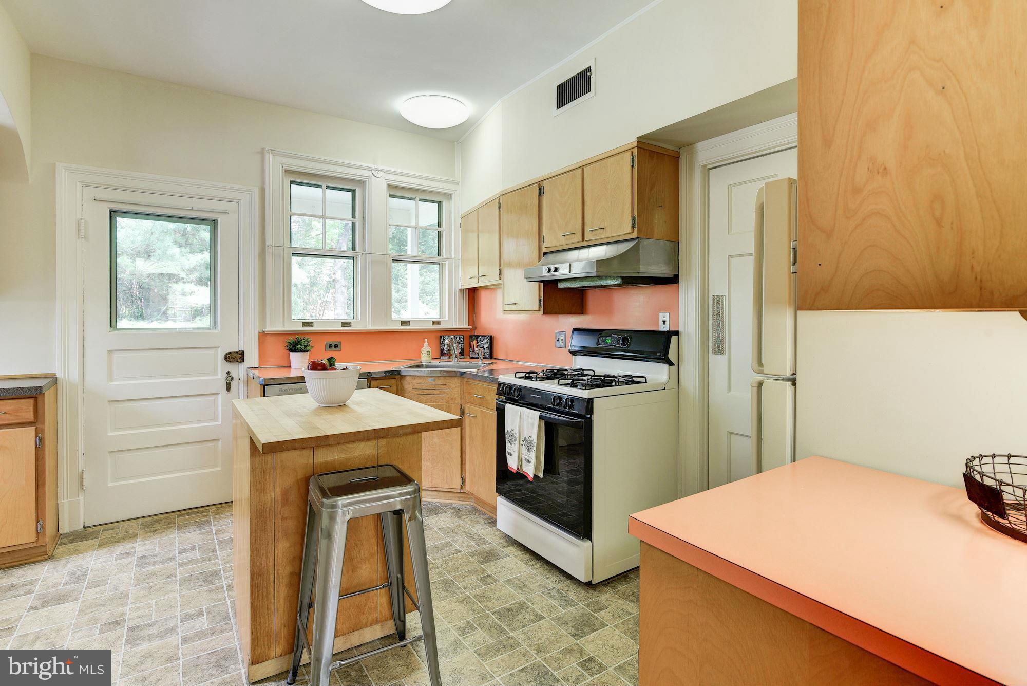 210 Baltimore Road Rockville, MD 20850 - Photo 9 of 30 a kitchen with a sink stove and refrigerator