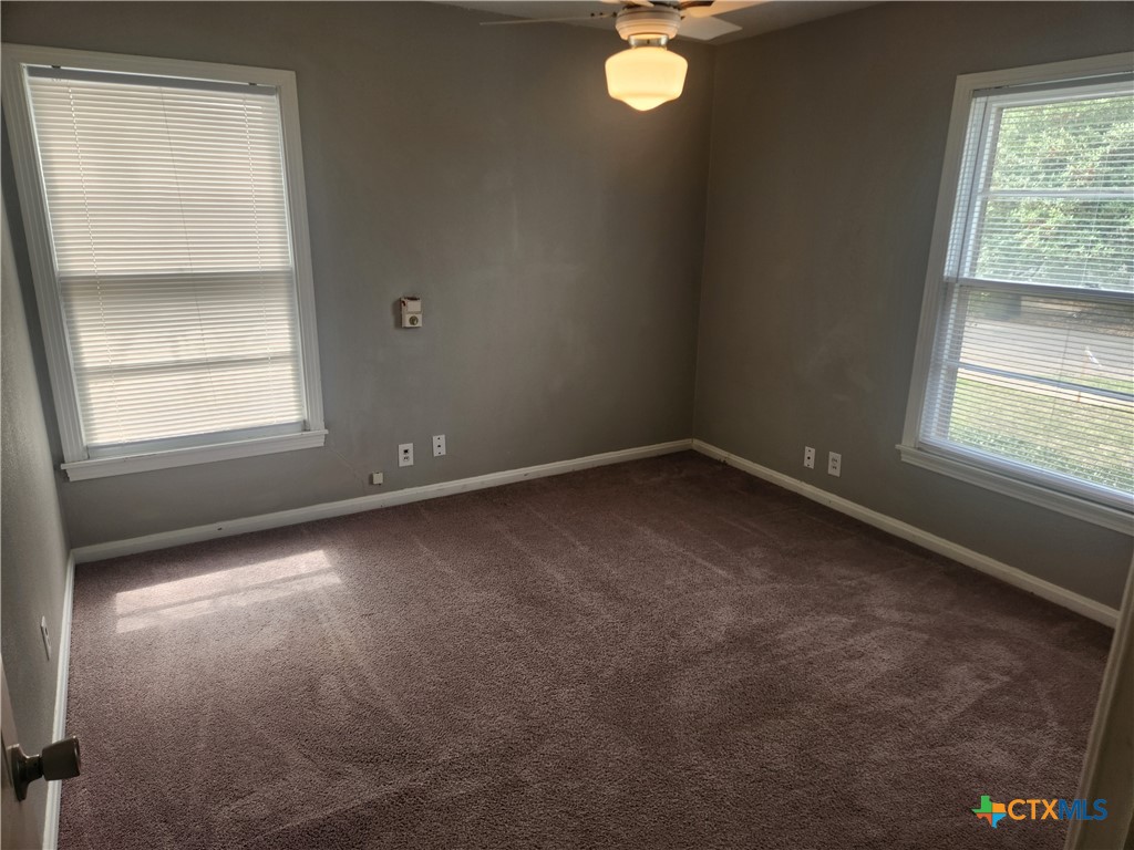 1615 South 15th Street Temple, TX 76504 - Photo 11 of 12 an empty room with a window