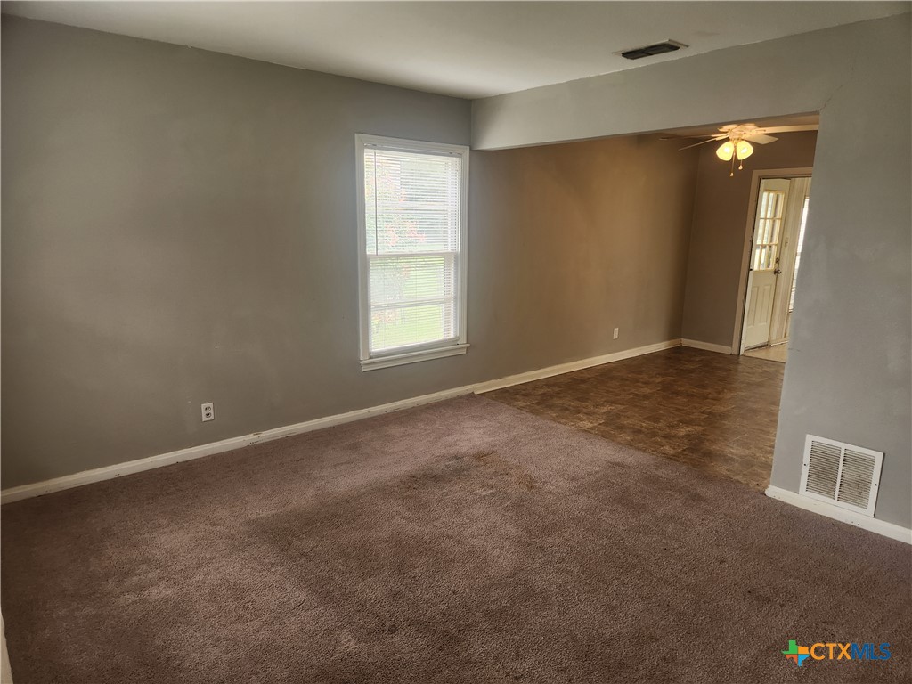 1615 South 15th Street Temple, TX 76504 - Photo 2 of 12 an empty room with windows