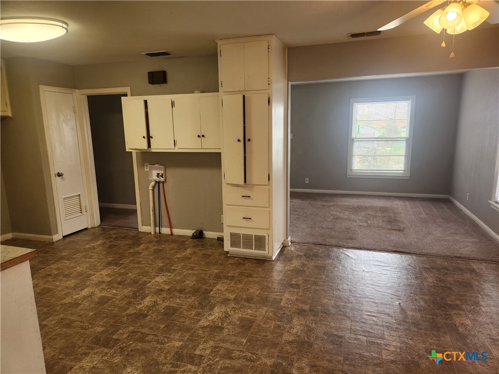1615 South 15th Street Temple, TX 76504 - Photo 6 of 12 a view of a refrigerator in kitchen and wooden floor