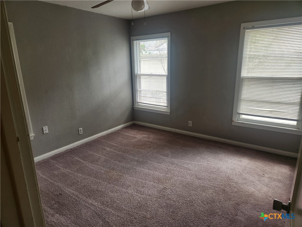 1615 South 15th Street Temple, TX 76504 - Photo 10 of 12 a view of an empty room with a window