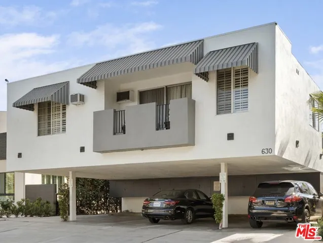 a view of car parked in front of house