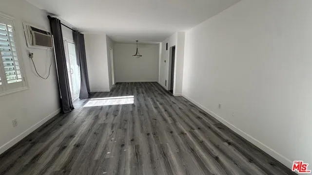 a view of wooden floor in an empty room