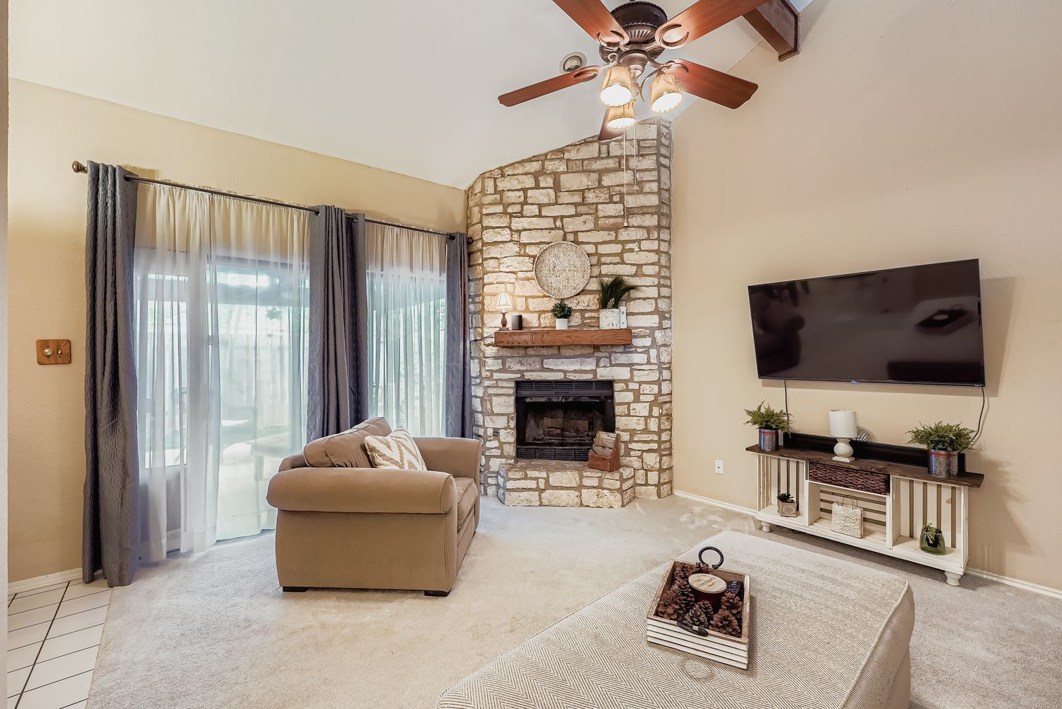 500 Hesters Crossing Road, Unit 310 Round Rock, TX 78681 - Photo 7 of 28 a living room with furniture and a flat screen tv