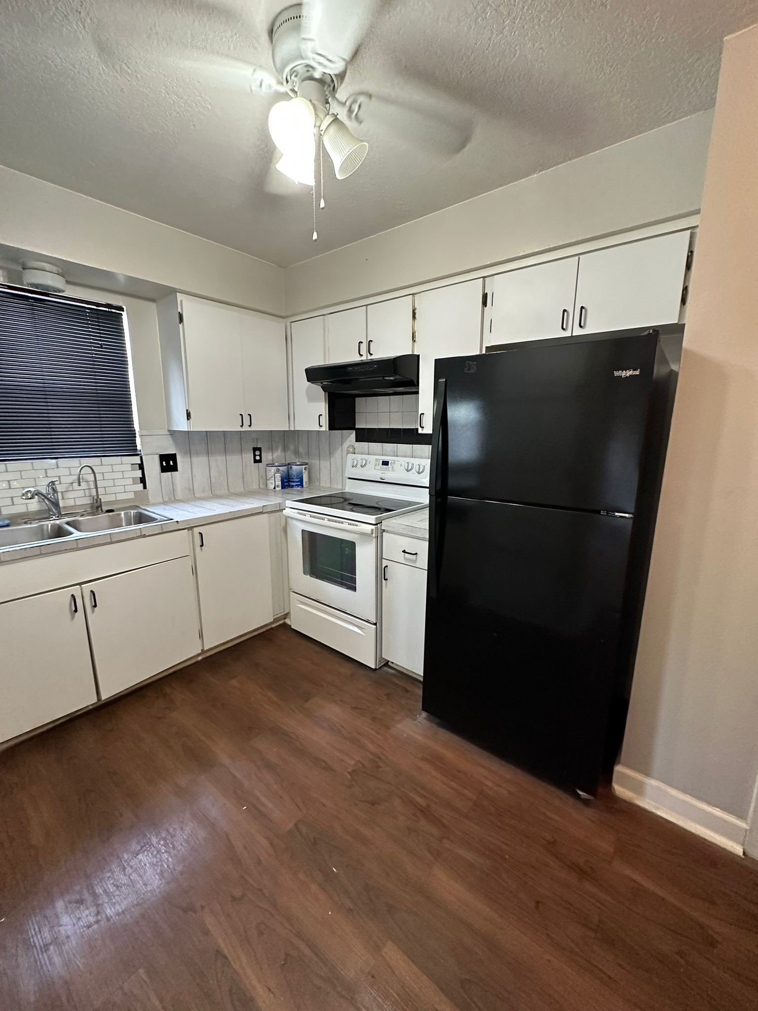 7305 South Gessner Road Houston, TX 77036 - Photo 13 of 24 a kitchen with stainless steel appliances a refrigerator sink and cabinets