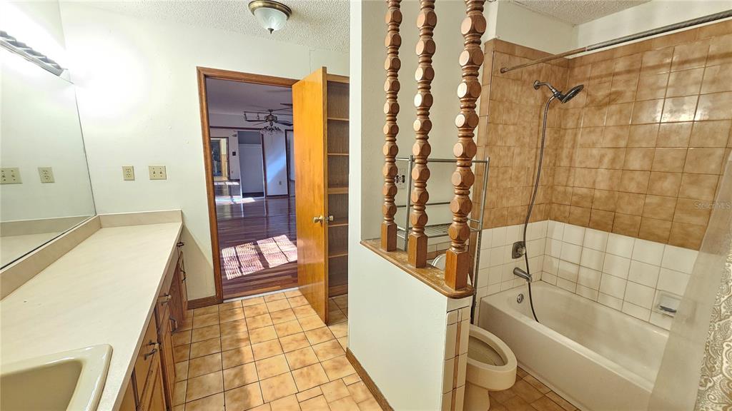 71 Dobson Street Orlando, FL 32805 - Photo 12 of 27 a bathroom with a bathtub and a shower