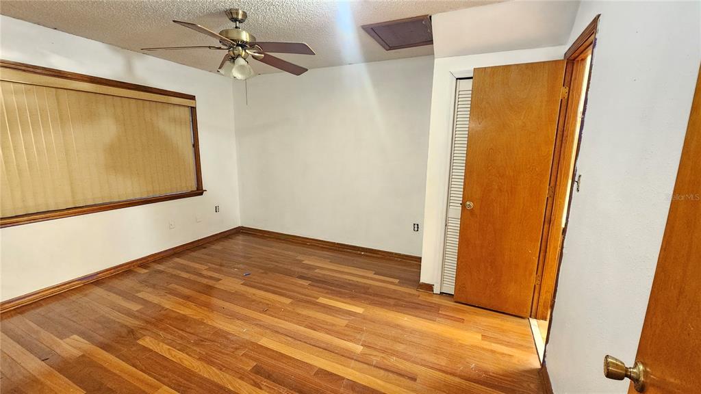 71 Dobson Street Orlando, FL 32805 - Photo 15 of 27 a view of a room with wooden floor and cabinet