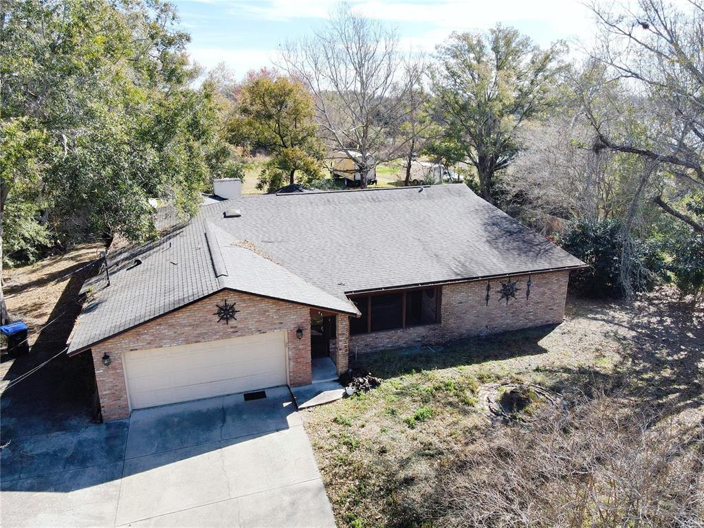 71 Dobson Street Orlando, FL 32805 - Photo 2 of 27 an aerial view of a house with a yard and large tree