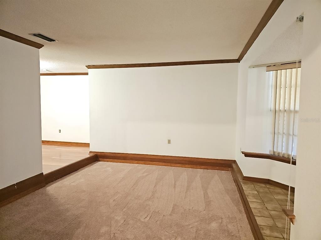 71 Dobson Street Orlando, FL 32805 - Photo 23 of 27 a view of an empty room with a window