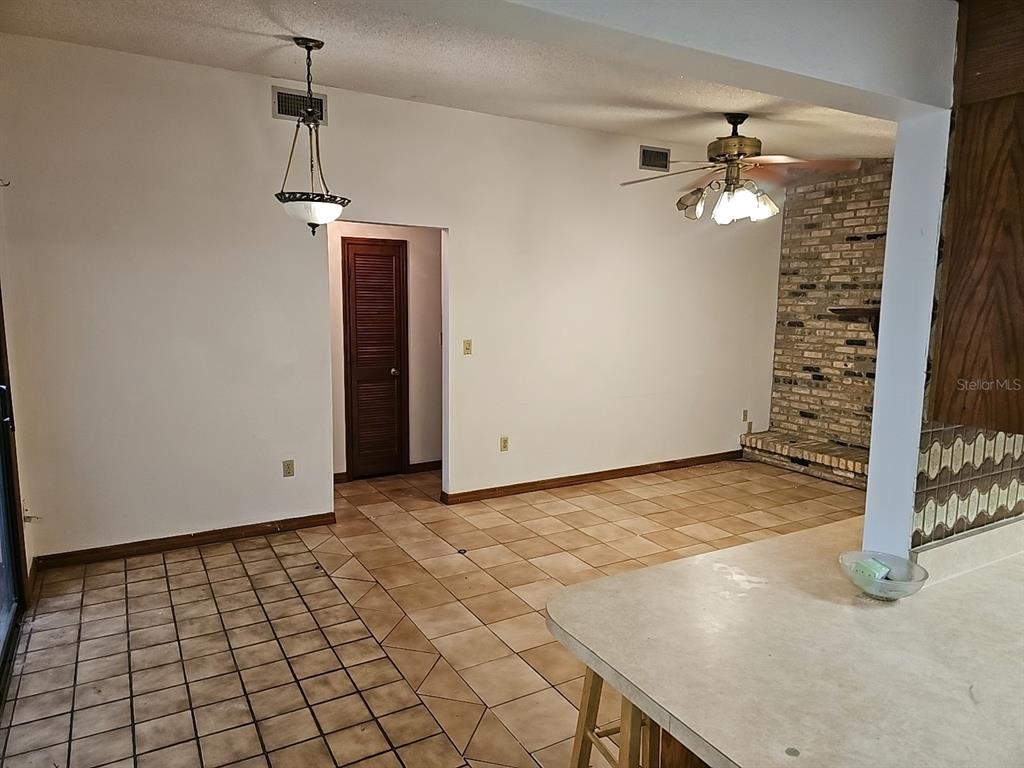 71 Dobson Street Orlando, FL 32805 - Photo 24 of 27 a view of a livingroom with a furniture and chandelier fan
