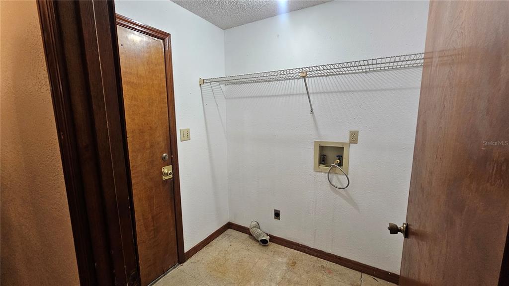 71 Dobson Street Orlando, FL 32805 - Photo 26 of 27 a bathroom with a shower and a sink