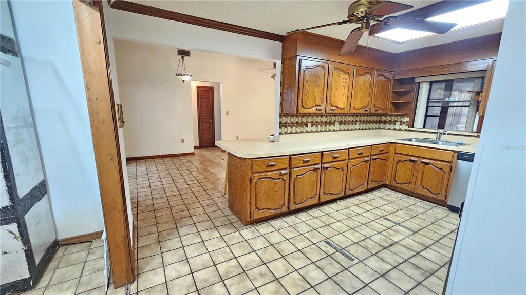 71 Dobson Street Orlando, FL 32805 - Photo 7 of 27 a kitchen with a sink and cabinets