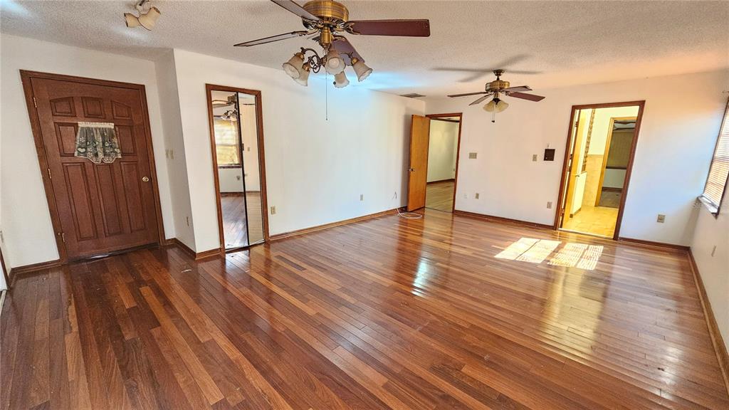 71 Dobson Street Orlando, FL 32805 - Photo 8 of 27 wooden floor in an empty room with a window