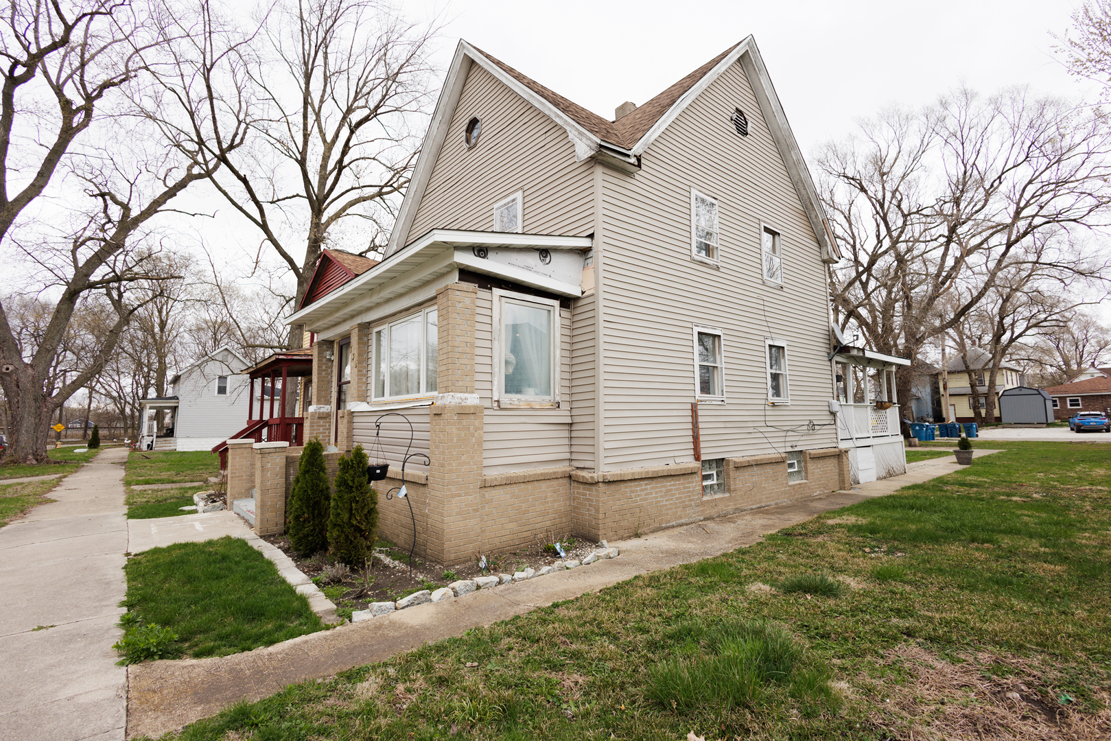 732 North Dearborn Avenue Kankakee, IL 60901 - Photo 2 of 21 a view of a white house with a yard