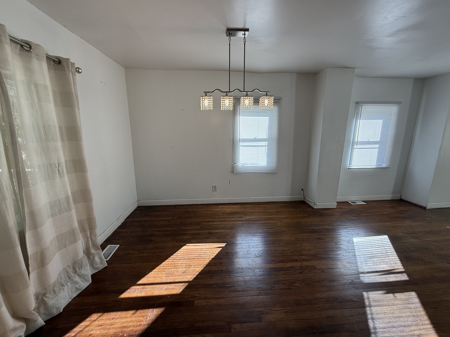 732 North Dearborn Avenue Kankakee, IL 60901 - Photo 6 of 21 a view of a room with wooden floor and window