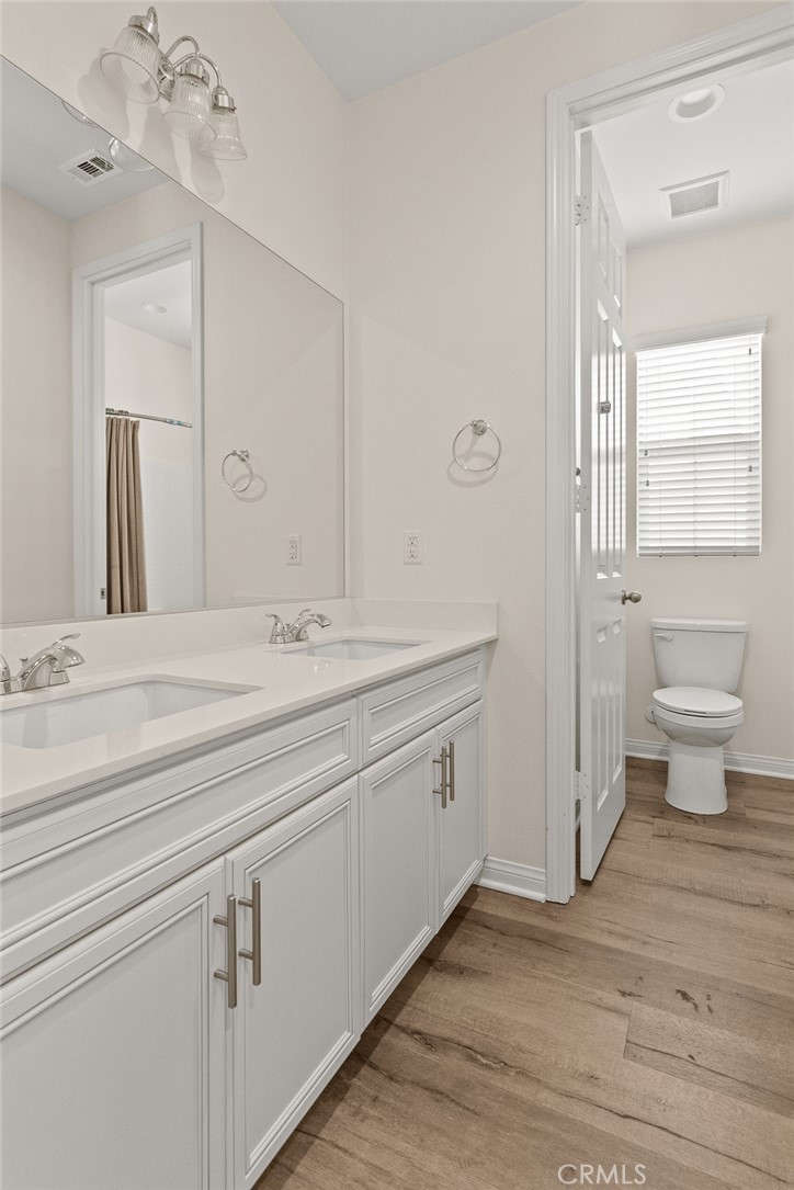 8743 Celebration Street Chino, CA 91708 - Photo 27 of 42 a bathroom with a sink and a mirror