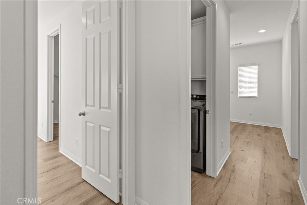 8743 Celebration Street Chino, CA 91708 - Photo 34 of 42 a view of a hallway with wooden floor and entryway