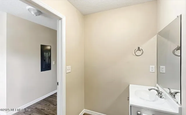 a bathroom with a sink and mirror