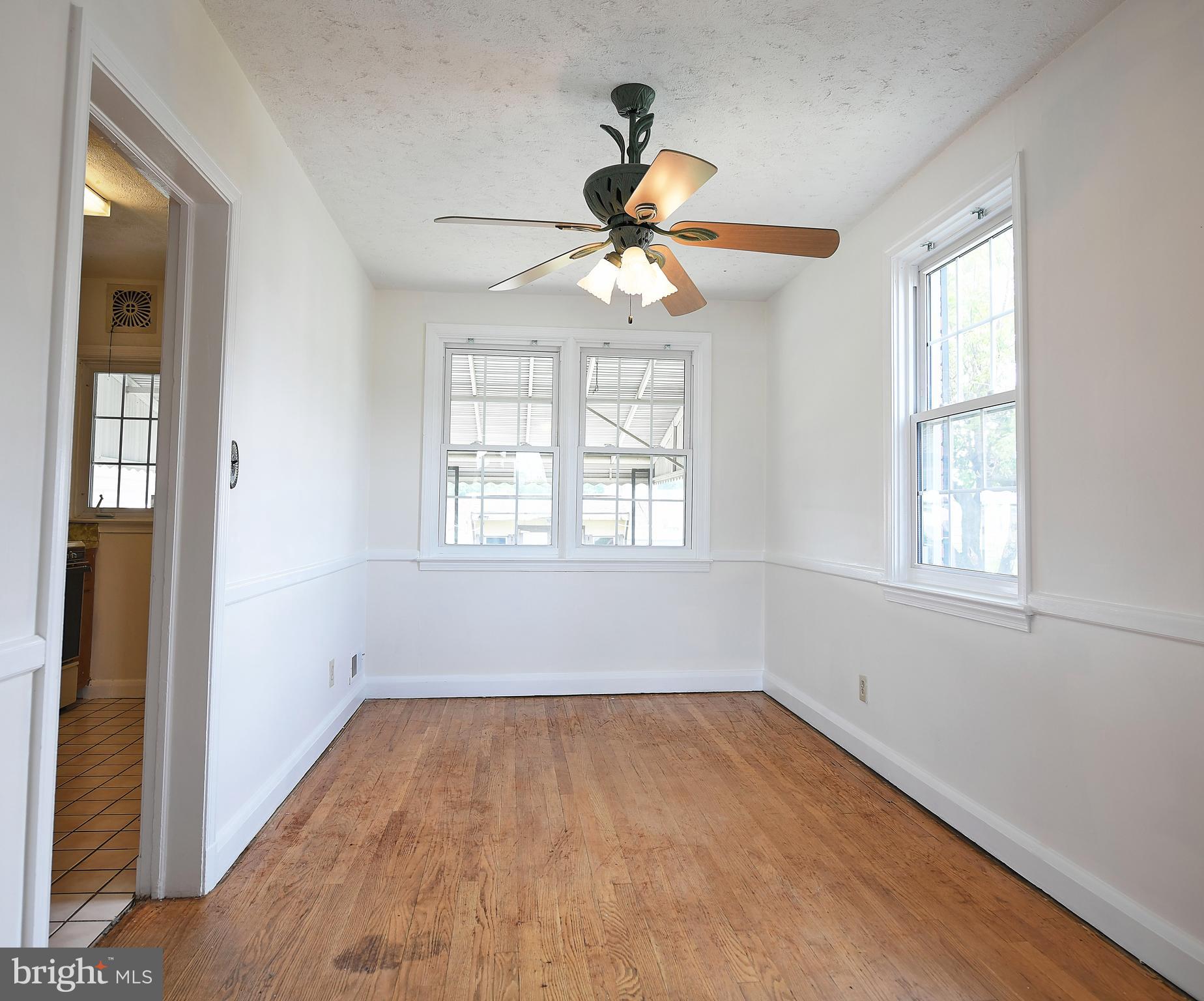 7601 Parkwood Road Baltimore, MD 21222 - Photo 16 of 32 Bright Dining Area/Decorative Ceiling Fan