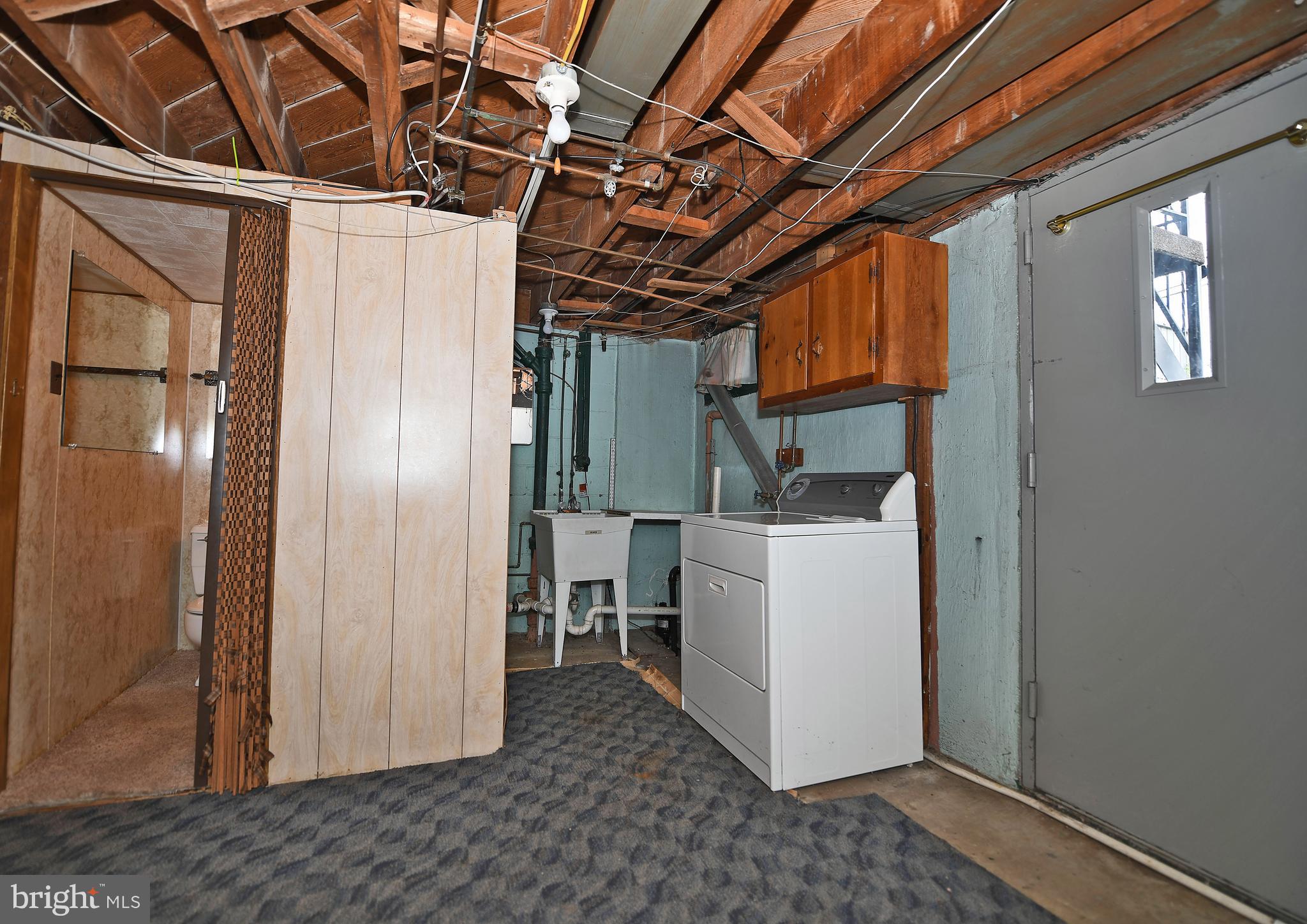 7601 Parkwood Road Baltimore, MD 21222 - Photo 30 of 32 Laundry and Storage Area / Steel Basement Door