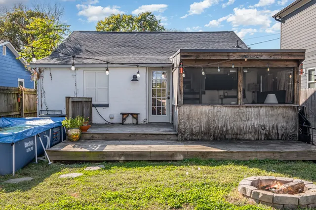 a view of a house and a swimming pool with a patio