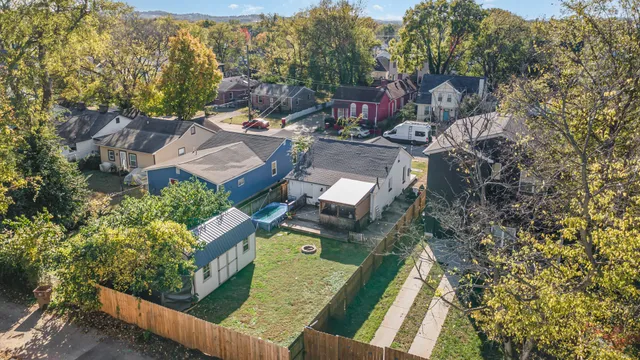 a aerial view of a house with a garden and trees