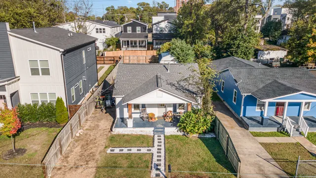 an aerial view of a house with a yard