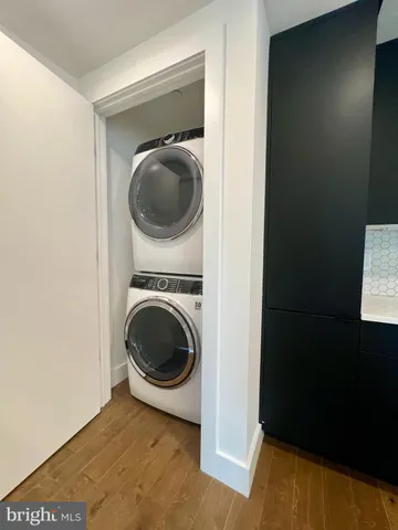 a view of a hallway with washer and dryer