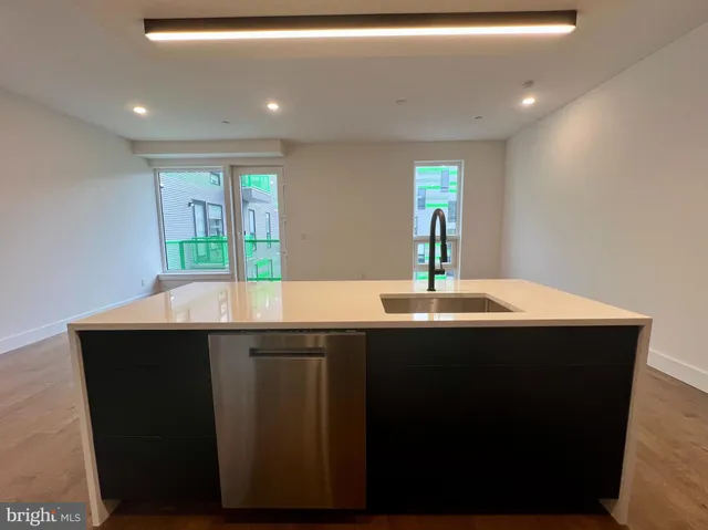 a kitchen with a sink and window