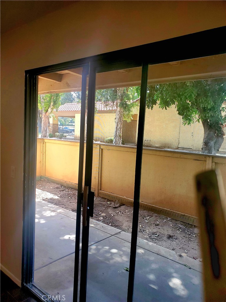 1110 West Blaine Street, Unit 107 Riverside, CA 92507 - Photo 20 of 34 a view of a glass door and porch