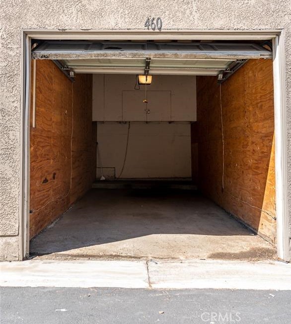1110 West Blaine Street, Unit 107 Riverside, CA 92507 - Photo 23 of 34 a view of room with a wooden door