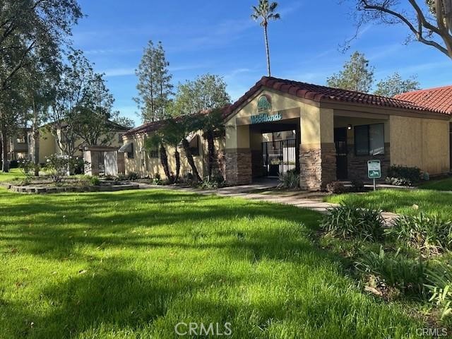 1110 West Blaine Street, Unit 107 Riverside, CA 92507 - Photo 24 of 34 Clubhouse and Entrance to Pool Area