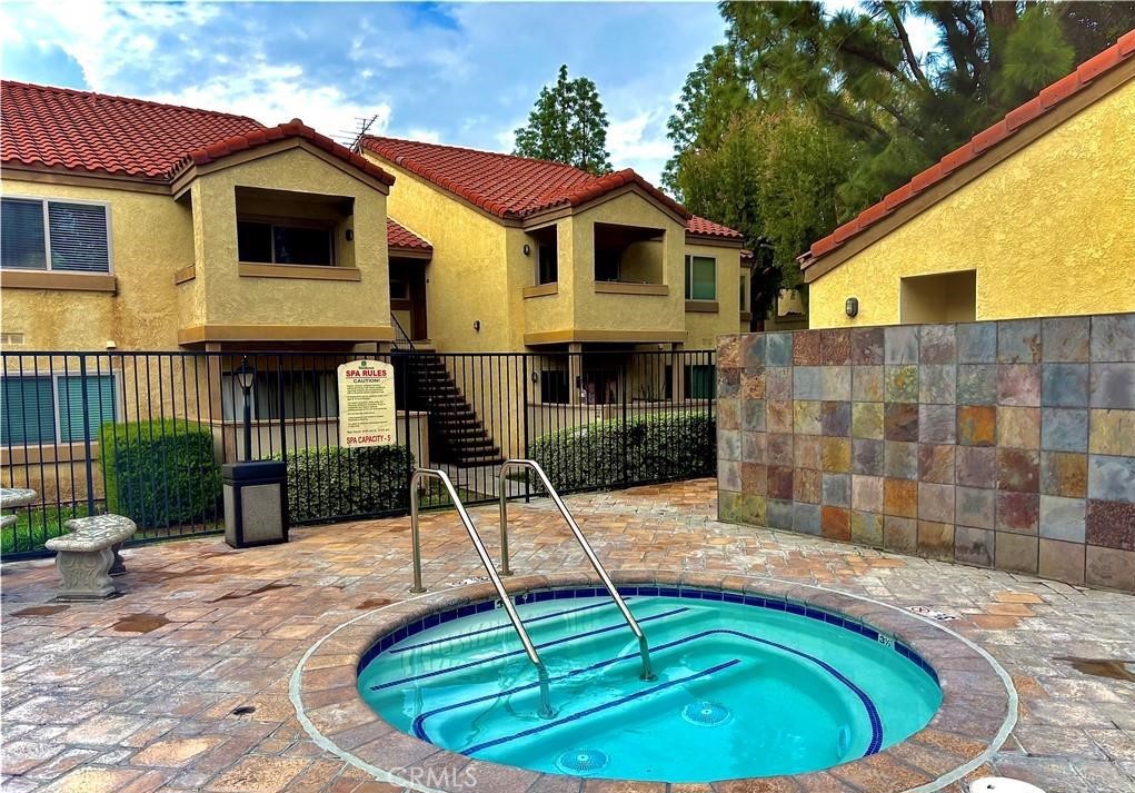 1110 West Blaine Street, Unit 107 Riverside, CA 92507 - Photo 26 of 34 a view of a house with swimming pool