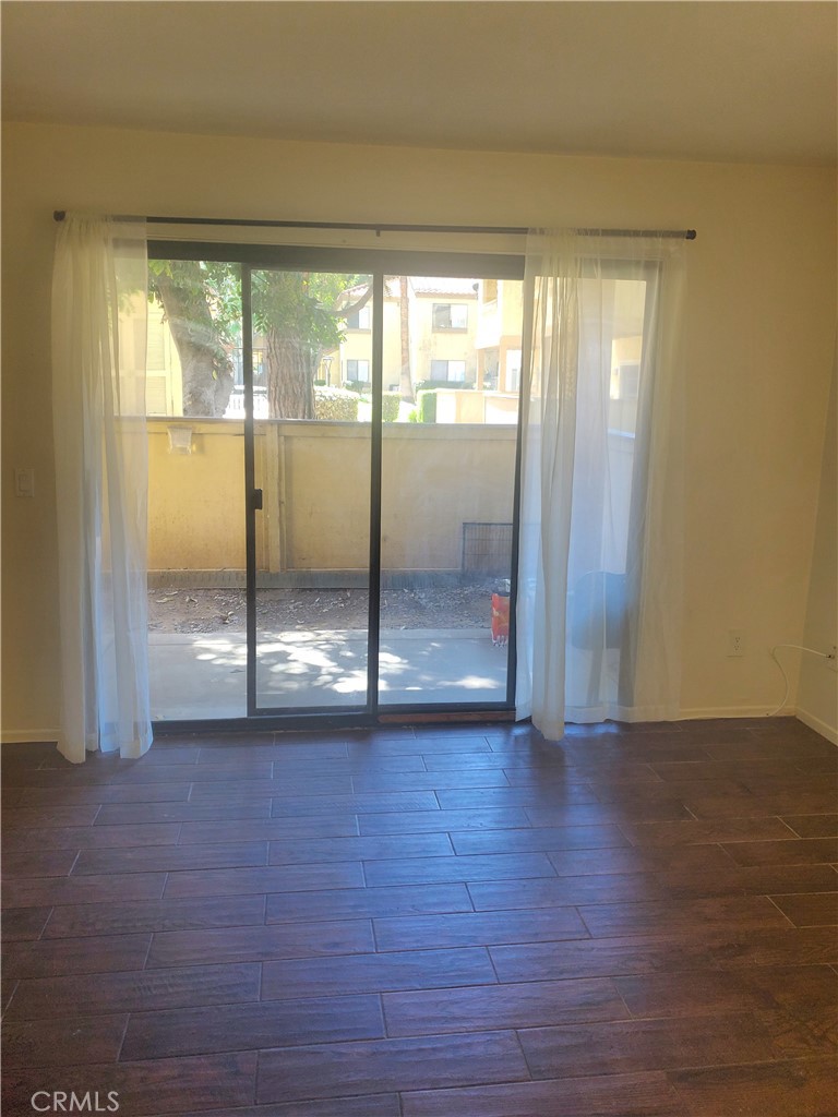 1110 West Blaine Street, Unit 107 Riverside, CA 92507 - Photo 8 of 34 To Patio from Living Room