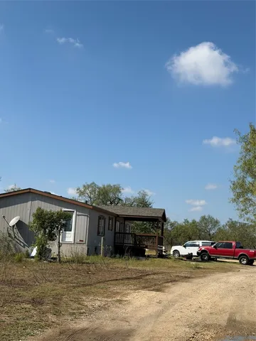 a view of a car park in front of house