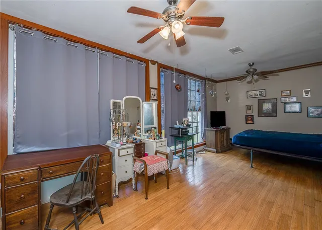 a bathroom with a sink a toilet a mirror and shower