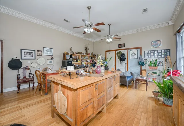 a large kitchen with kitchen island a large counter space a sink appliances and a window