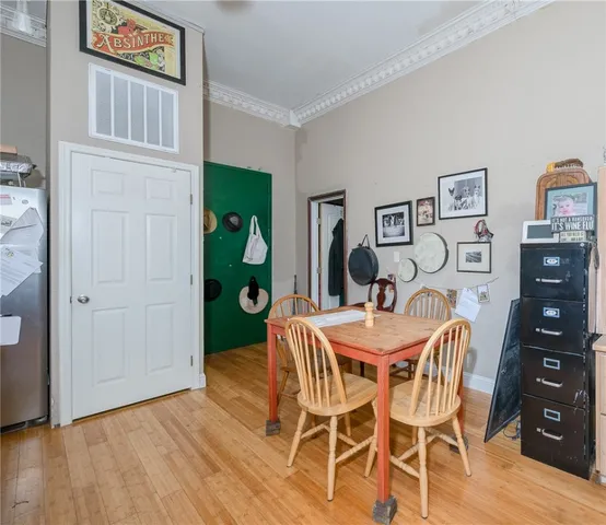 a living room with kitchen island furniture and a chandelier