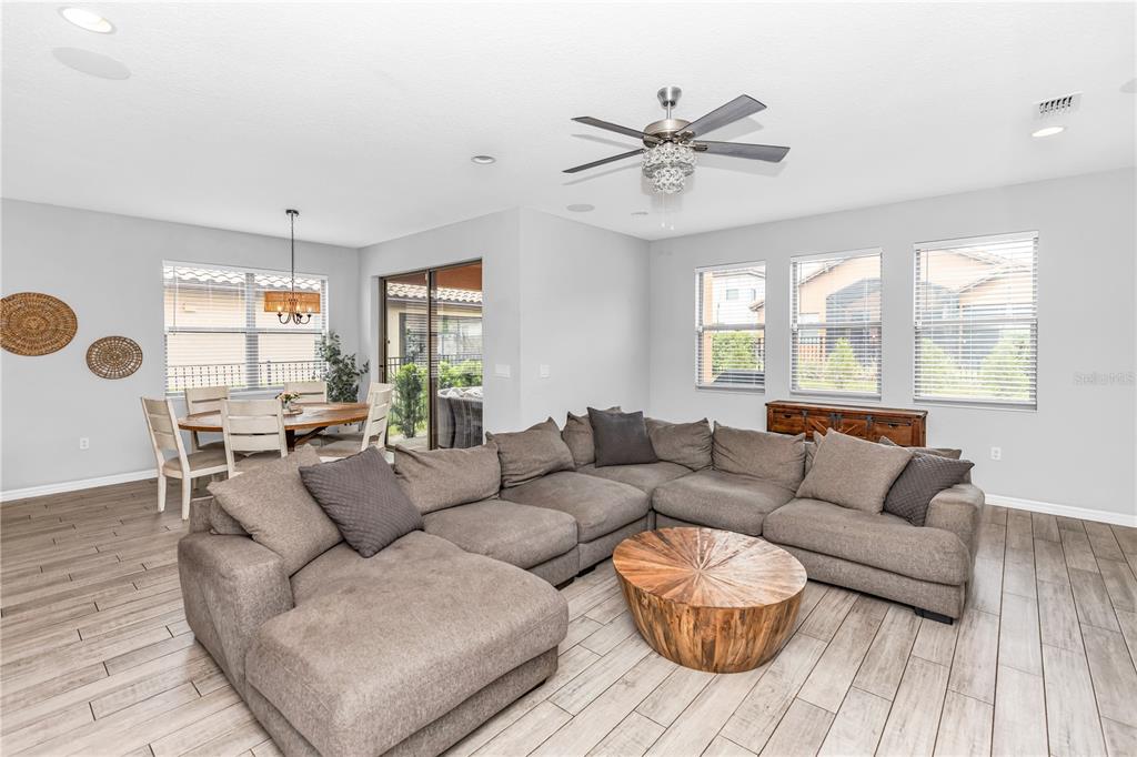239 Lugano Way DeBary, FL 32713 - Photo 17 of 52 a living room with furniture and a large window