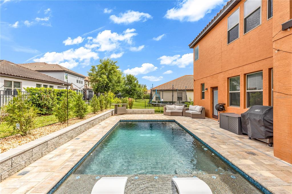 239 Lugano Way DeBary, FL 32713 - Photo 2 of 52 a swimming pool with outdoor seating and yard