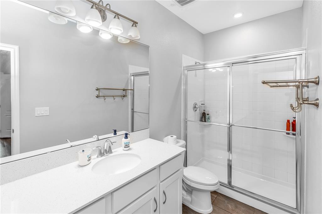 239 Lugano Way DeBary, FL 32713 - Photo 33 of 52 a bathroom with a sink toilet and shower